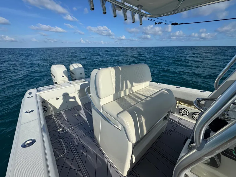 Slide: The Image of 2017 SeaVee 340Z boat on open ocean, featuring dual engines and spacious seating. - 13