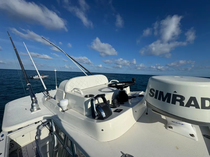 Slide: The Image of 2017 SeaVee 340Z boat with Simrad equipment on open water under blue sky. - 14