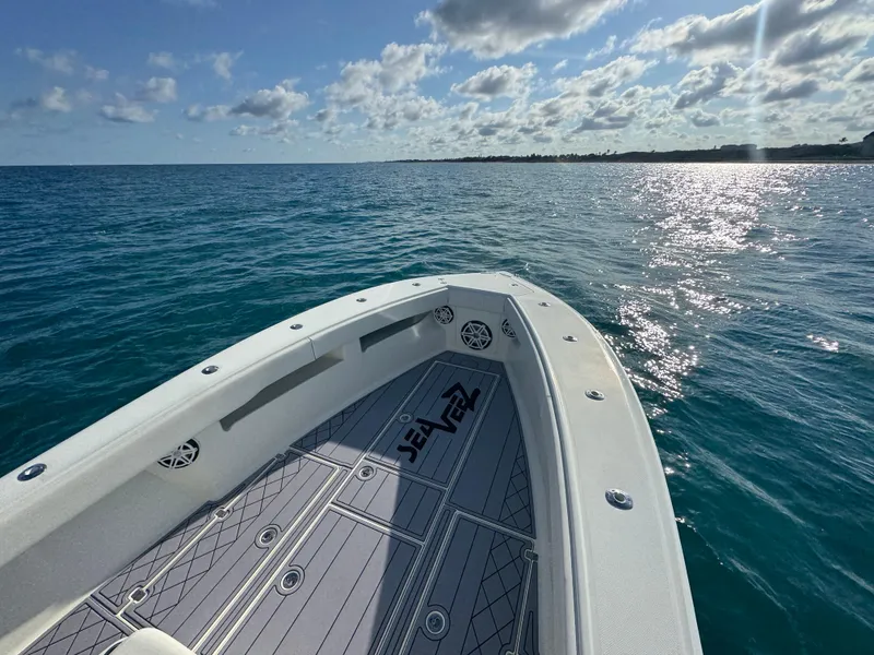 Slide: The Image of 2017 SeaVee 340Z boat on calm ocean waters under a partly cloudy sky. - 15
