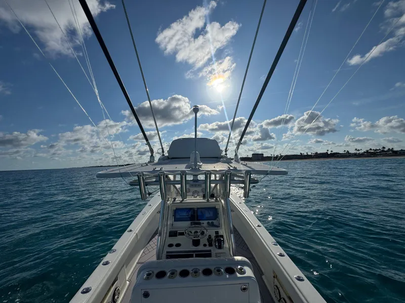 Slide: The Image of 2017 SeaVee 340Z boat on open water under a bright, sunny sky. - 19