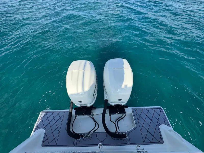 Slide: The Image of 2017 SeaVee 340Z boat with twin outboard engines on clear blue water. - 20
