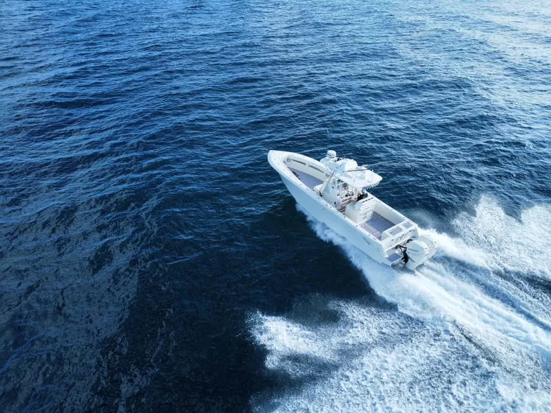 Slide: The Image of 2017 SeaVee 340Z boat cruising on open ocean waters. - 5