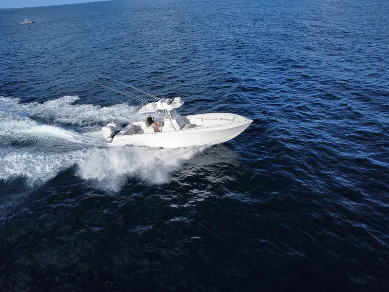 Slide: The Image of 2017 SeaVee 340Z boat cruising on open ocean waters. - 8