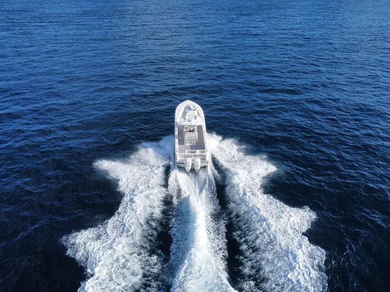 Slide: The Image of 2017 SeaVee 340Z boat cruising on open blue ocean waters. - 9