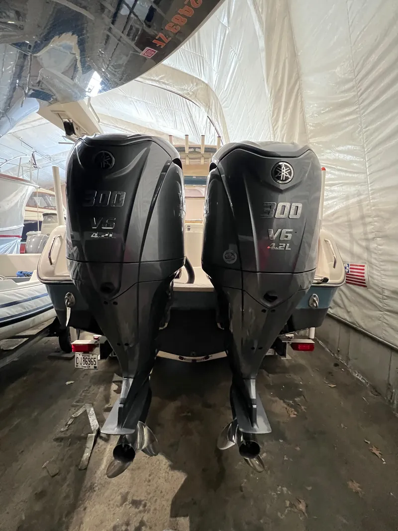 Slide: The Image of 2021 Grady-White Freedom 285 with twin 300 HP outboard engines in storage. - 13