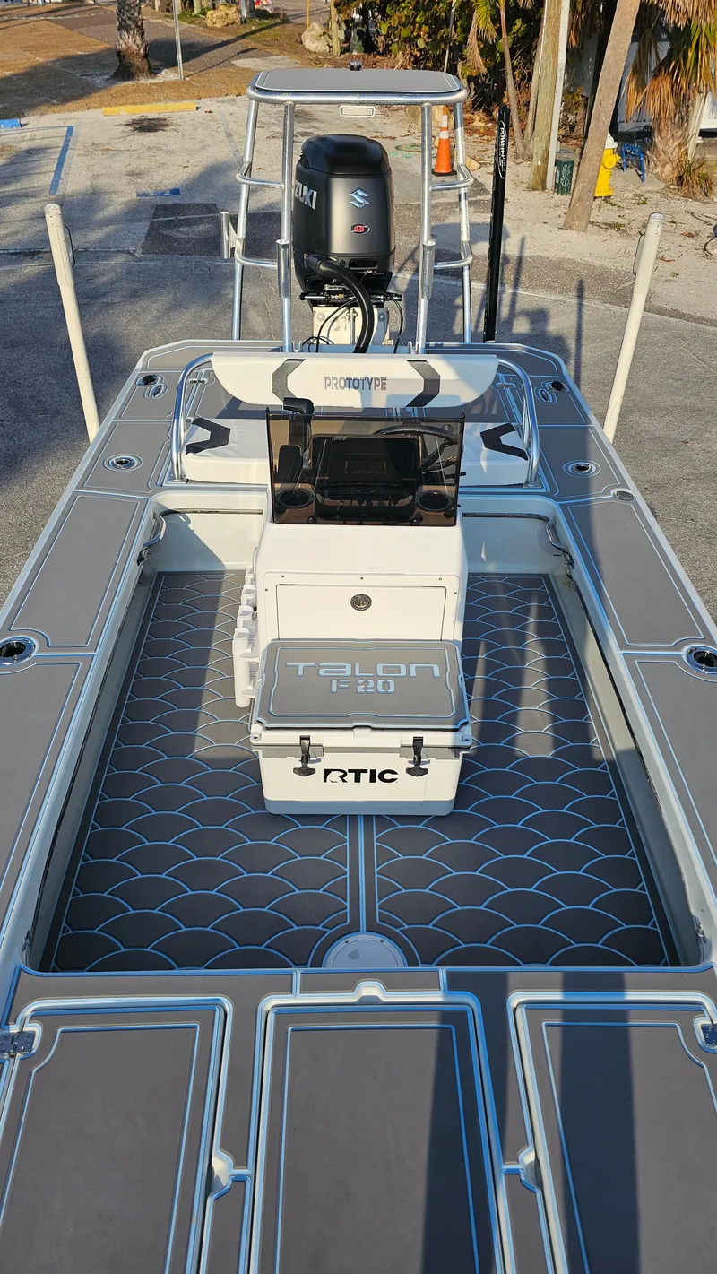 Slide: The Image of Talon F-20 boat, 1992 model, with modern deck design and outboard motor. - 10