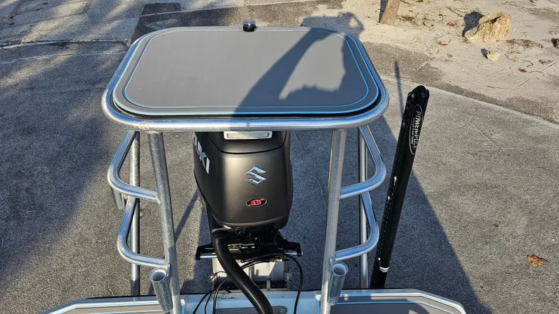 Slide: The Image of Talon F-20 boat with Suzuki outboard motor, 1992 model, on a sunny day. - 13