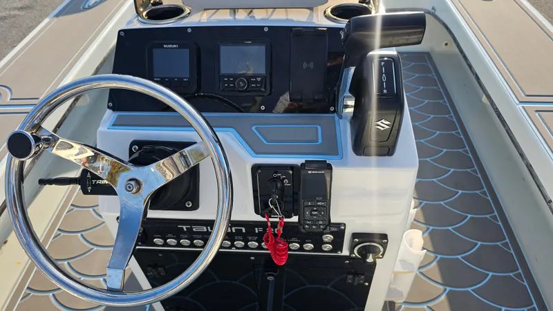 Slide: The Image of 1992 Talon F-20 boat dashboard with steering wheel and control panel. - 14