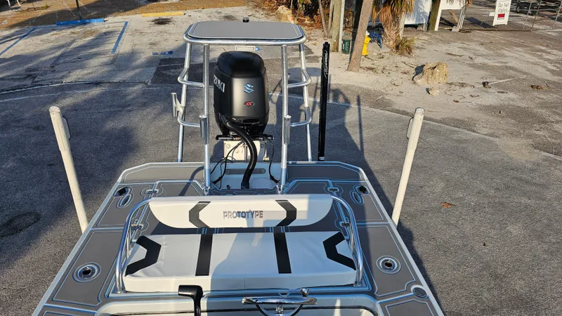 Slide: The Image of Talon F-20 boat, 1992 model, with Suzuki outboard motor, parked on a concrete surface. - 7