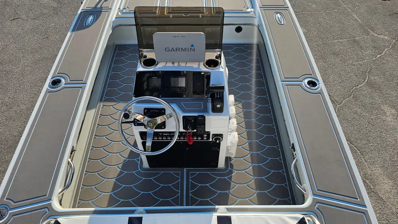 Slide: The Image of Talon F-20 boat interior with Garmin navigation, 1992 model, featuring modern dashboard and steering wheel. - 9