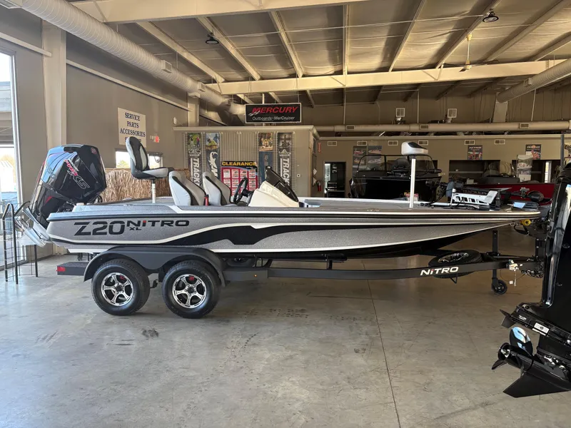 The Image of 2025 Nitro Z20 XL Pro boat in showroom, side view, on trailer. - 0