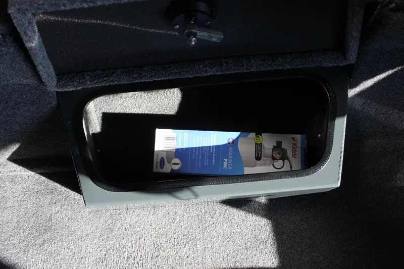 Slide: The Image of Storage compartment in 2025 Ranger RT188P boat with a marine product inside. - 8
