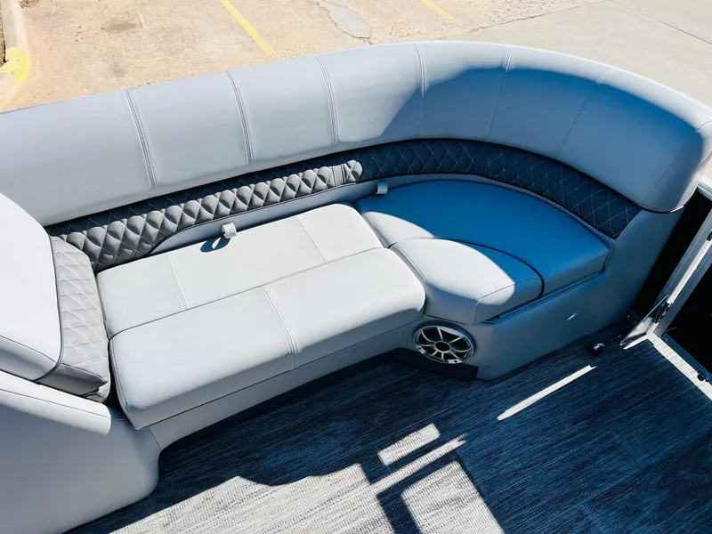 Slide: The Image of 2025 Ranger Reata 223C boat interior with luxurious gray seating and stylish design. - 14