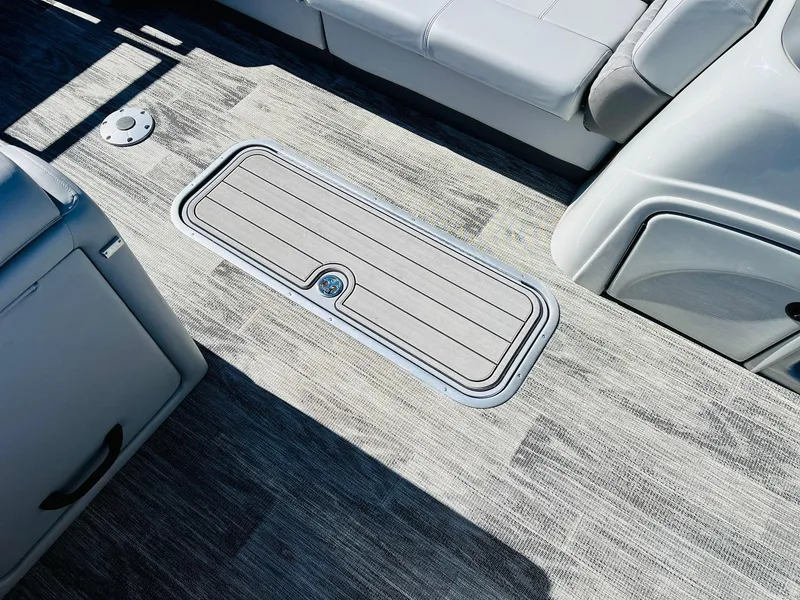 Slide: The Image of 2025 Ranger Reata 223C boat interior with sleek flooring and seating. - 22