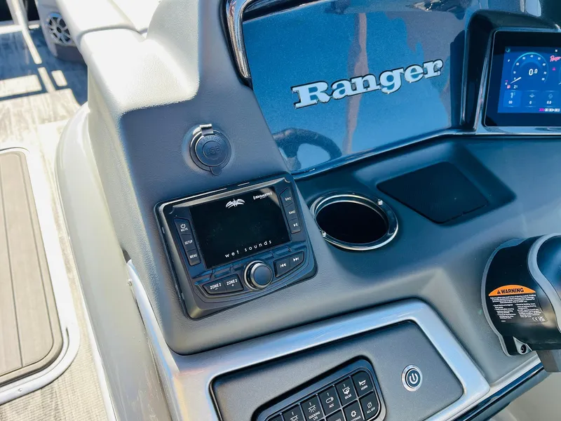 Slide: The Image of Control panel of 2025 Ranger Reata 223C boat with modern dashboard features. - 32