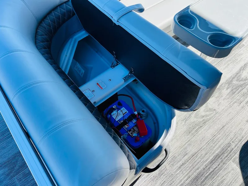 Slide: The Image of 2025 Ranger Reata 223C boat seat storage with battery compartment. - 36