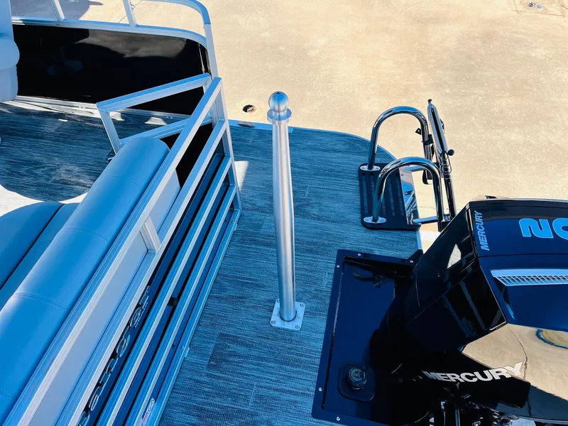 Slide: The Image of 2025 Ranger Reata 223C boat deck with Mercury outboard motor and seating area. - 40