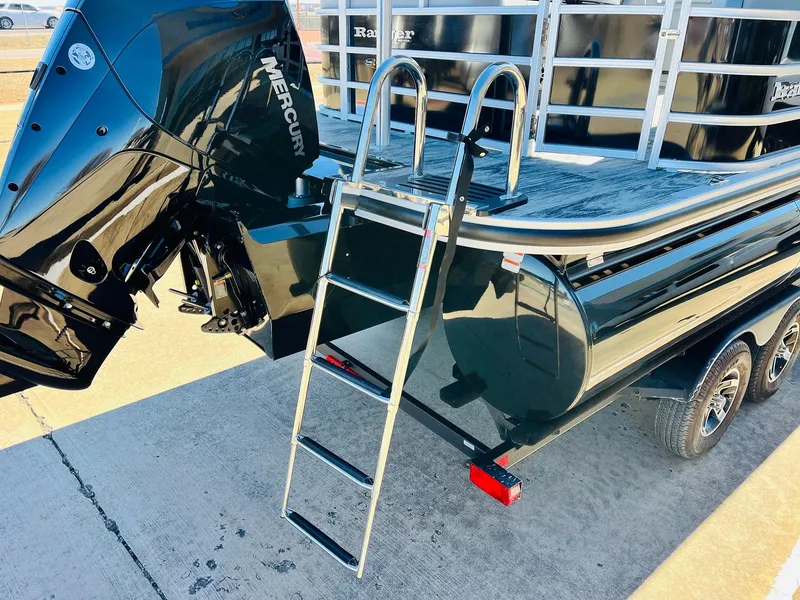 Slide: The Image of 2025 Ranger Reata 223C boat with Mercury engine and ladder on trailer. - 8