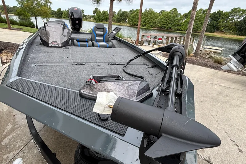 Slide: The Image of 2025 Ranger RT188P fishing boat docked by a scenic lake. - 85