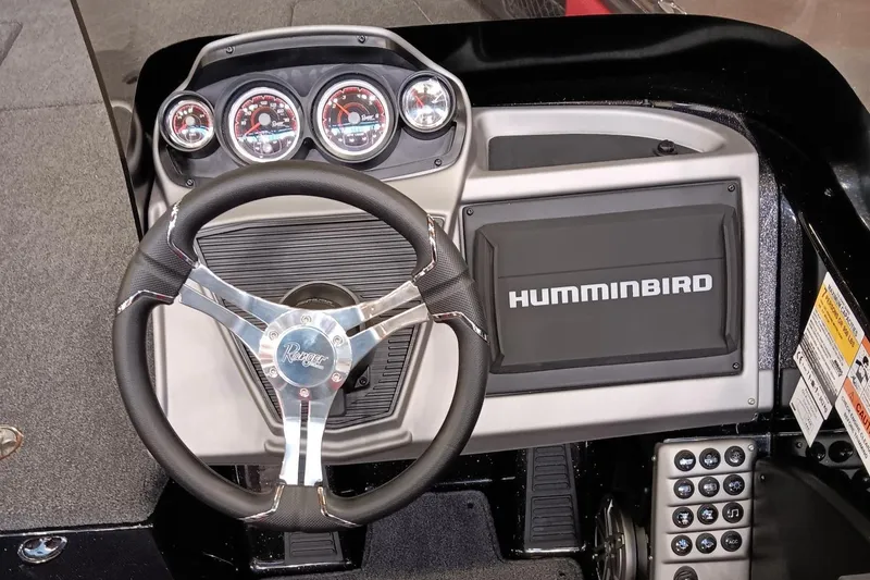 Slide: The Image of 2025 Ranger 1880MS boat dashboard with steering wheel and Humminbird display. - 3