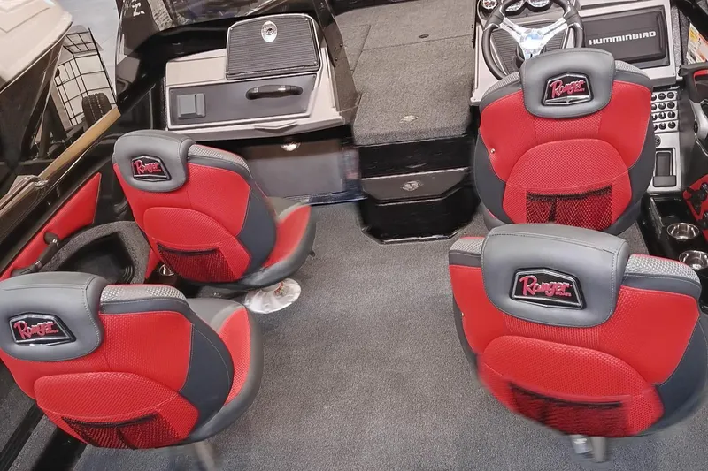 Slide: The Image of 2025 Ranger 1880MS boat interior with red and gray seating and advanced dashboard controls. - 4