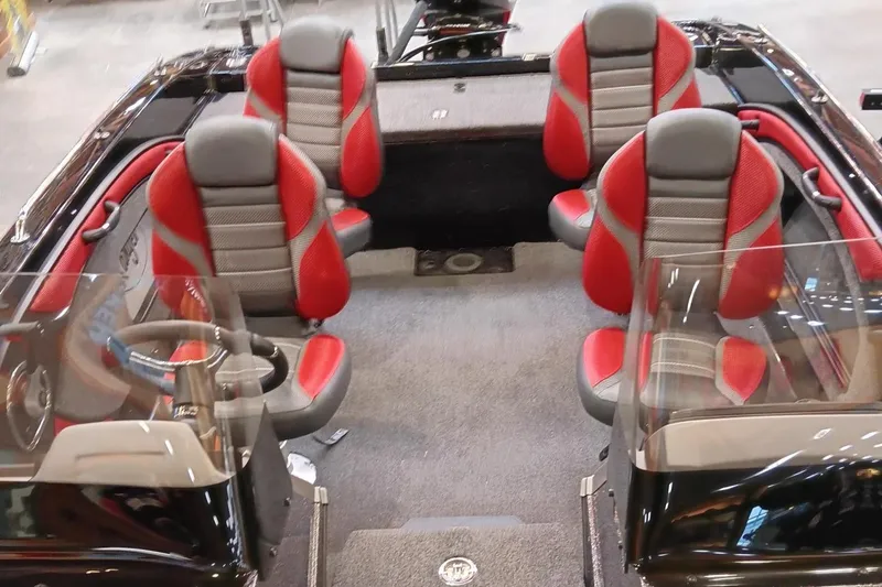 Slide: The Image of 2025 Ranger 1880MS boat interior with red and gray seating, showcasing modern design. - 5