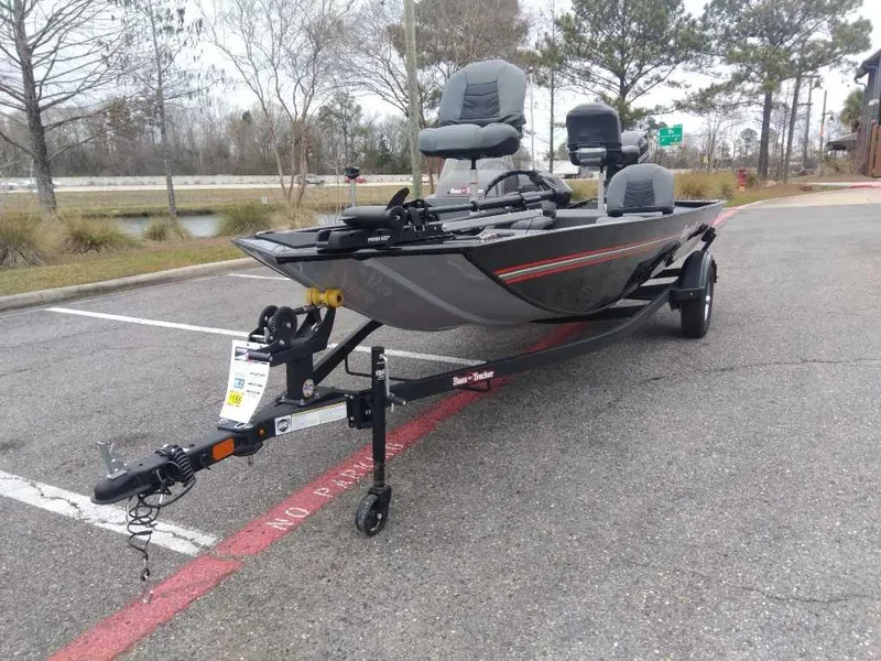 Slide: The Image of 2025 Tracker Bass Tracker Classic XL boat on trailer in parking lot. - 13