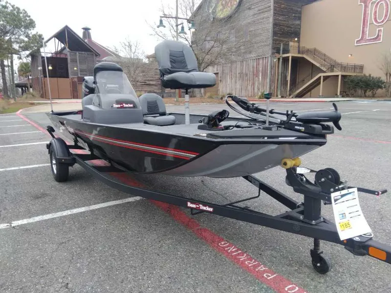 Slide: The Image of 2025 Tracker Bass Tracker Classic XL boat on trailer in parking lot. - 5