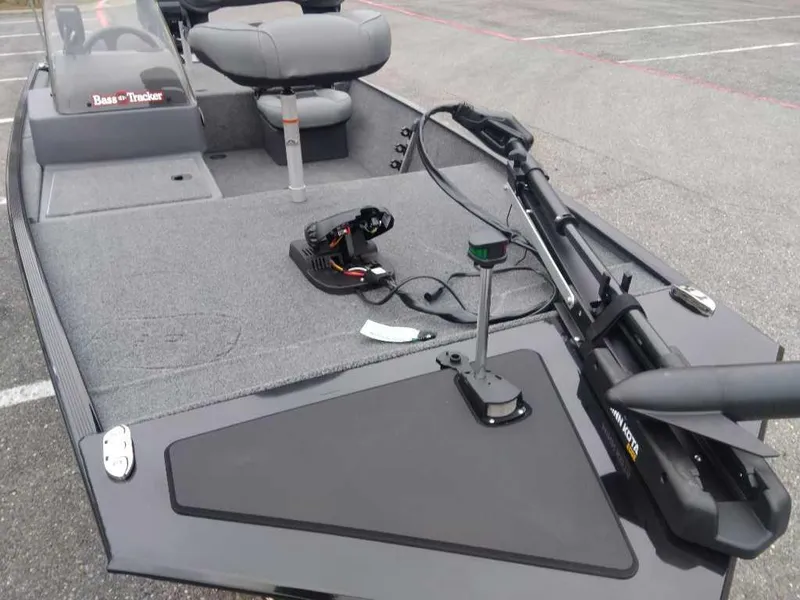 Slide: The Image of 2025 Tracker Bass Tracker Classic XL boat interior with seating and fishing equipment. - 7