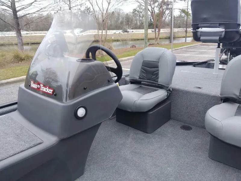 Slide: The Image of 2025 Tracker Bass Tracker Classic XL boat interior with steering console and seating. - 9