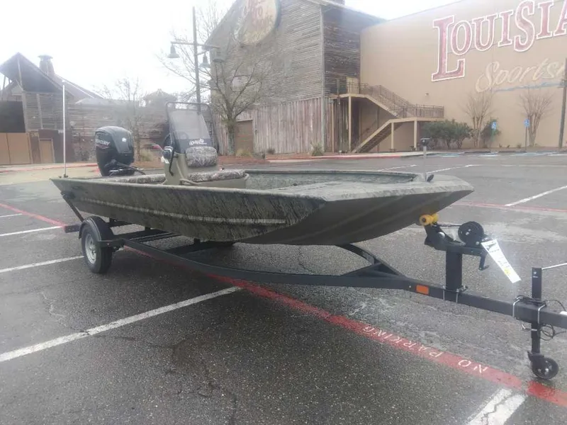 Slide: The Image of 2025 Tracker Grizzly 1860 CC boat on trailer in parking lot. - 5