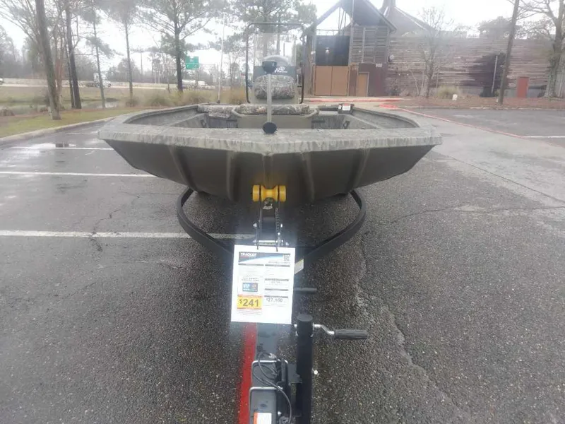 Slide: The Image of 2025 Tracker Grizzly 1860 CC boat on trailer in parking lot, overcast day. - 6