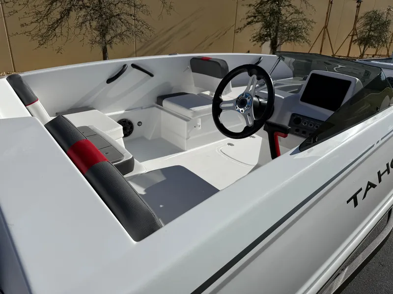 Slide: The Image of 2025 Tahoe T18 boat interior with steering wheel and seating. - 2