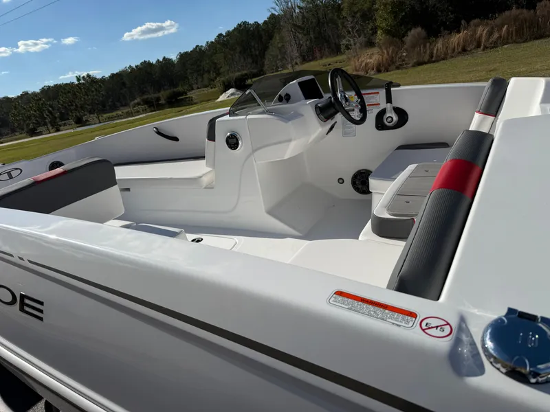 Slide: The Image of 2025 Tahoe T18 boat interior with sleek white design and modern steering console. - 3