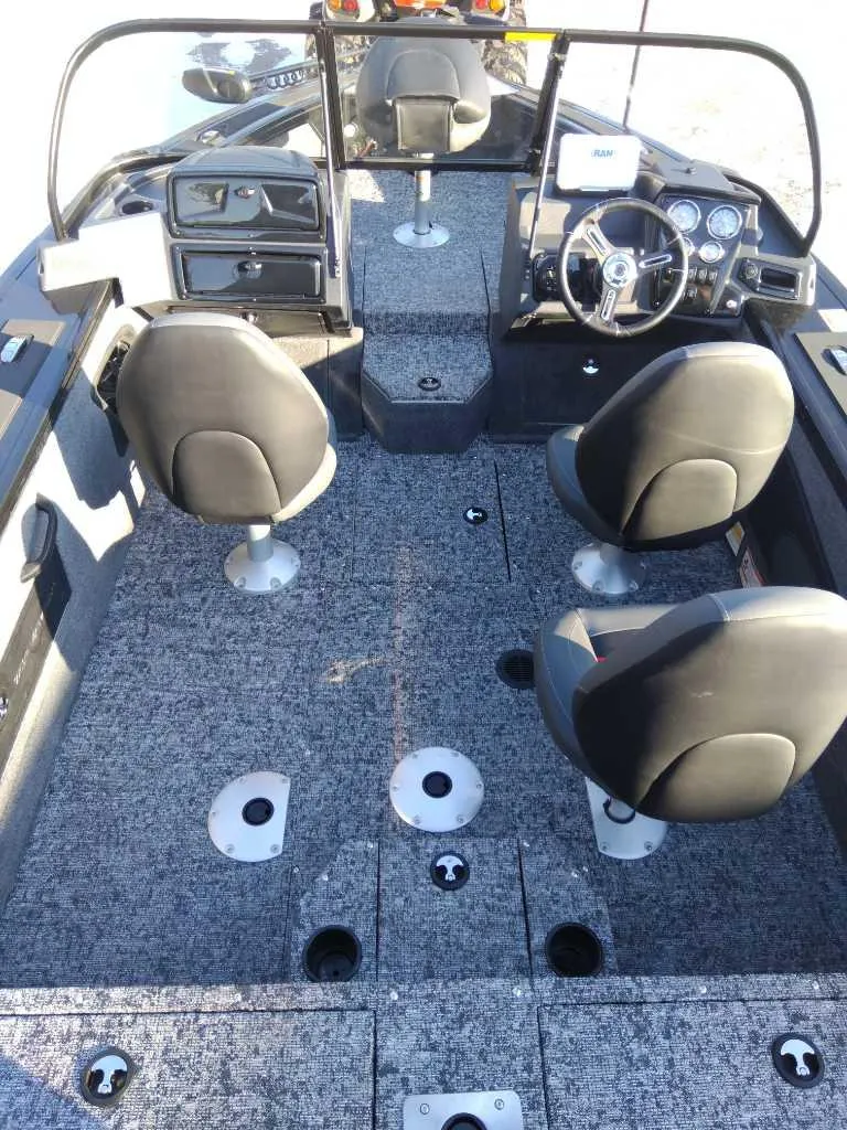 Slide: The Image of 2025 Tracker Targa V-18 WT boat interior with seating and dashboard. - 5