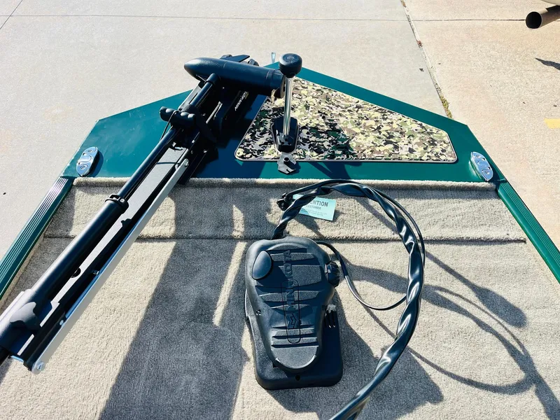 Slide: The Image of 2025 Tracker Bass Tracker Classic Limited boat with trolling motor and foot pedal on deck. - 11