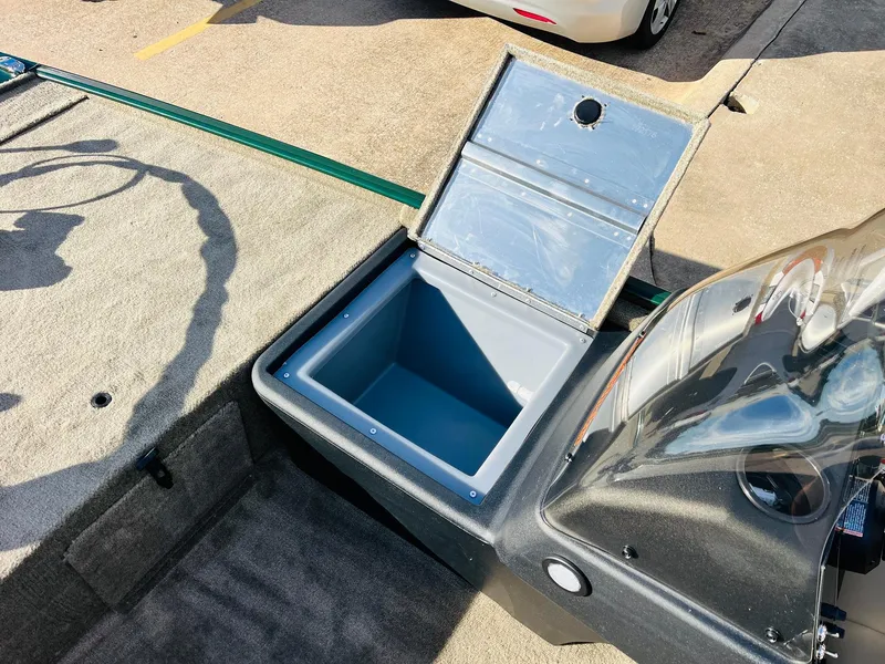 Slide: The Image of 2025 Tracker Bass Tracker Classic Limited boat with open storage compartment. - 12