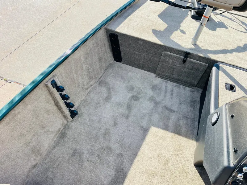 Slide: The Image of 2025 Tracker Bass Tracker Classic Limited boat interior with carpeted flooring and storage compartments. - 16