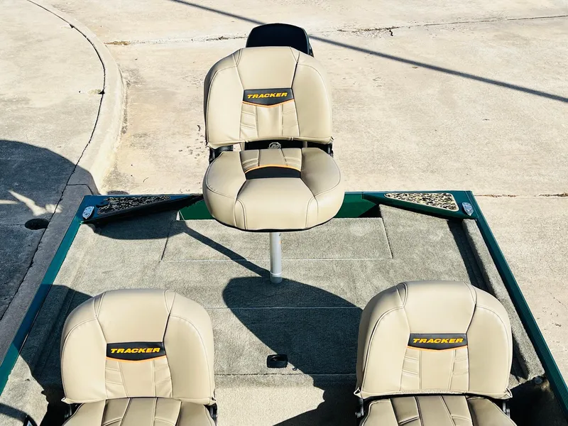Slide: The Image of 2025 Tracker Bass Tracker Classic Limited boat seats in beige upholstery. - 29