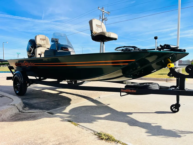 Slide: The Image of 2025 Tracker Bass Tracker Classic Limited boat on trailer, parked outdoors. - 3