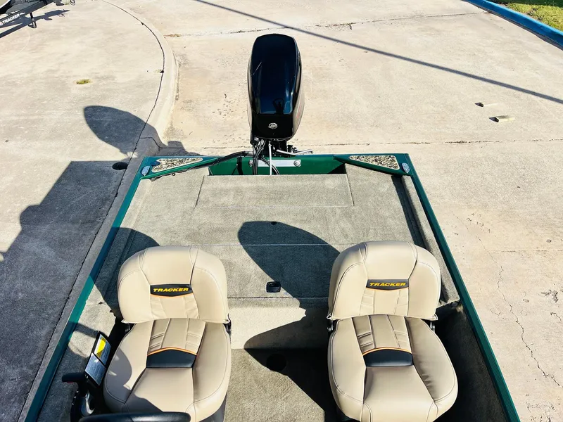 Slide: The Image of 2025 Tracker Bass Tracker Classic Limited boat with dual seats and motor. - 30