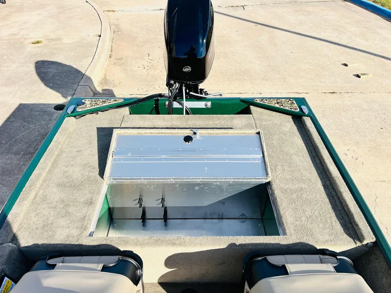 Slide: The Image of 2025 Tracker Bass Tracker Classic Limited boat interior with open storage compartment. - 33