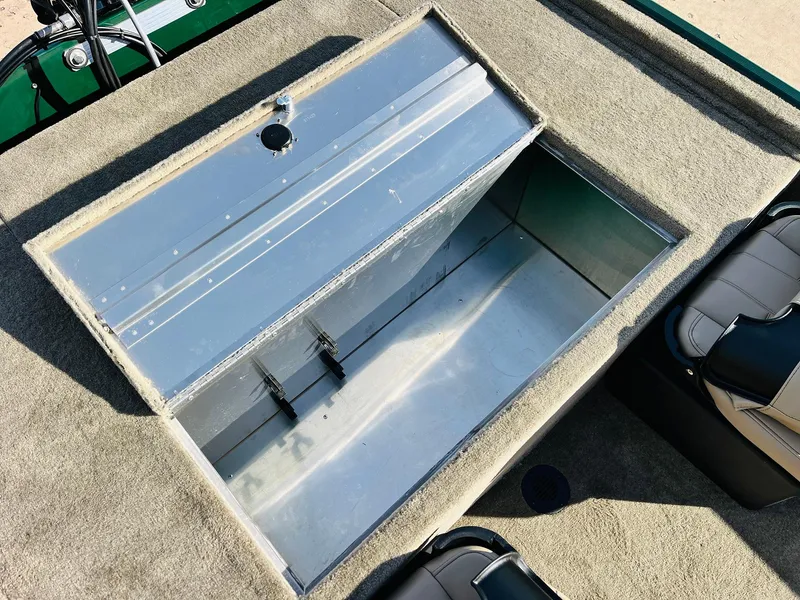 Slide: The Image of 2025 Tracker Bass Tracker Classic Limited boat storage compartment, open and empty. - 34