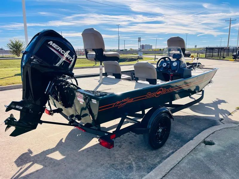 Slide: The Image of 2025 Tracker Bass Tracker Classic Limited boat with Mercury engine on trailer. - 4