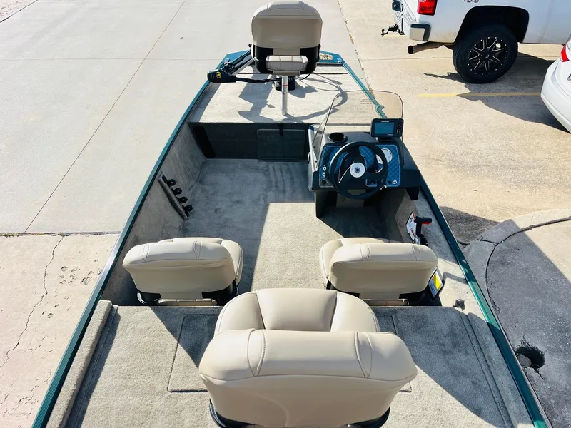 Slide: The Image of 2025 Tracker Bass Tracker Classic Limited boat interior with seating and steering console. - 7