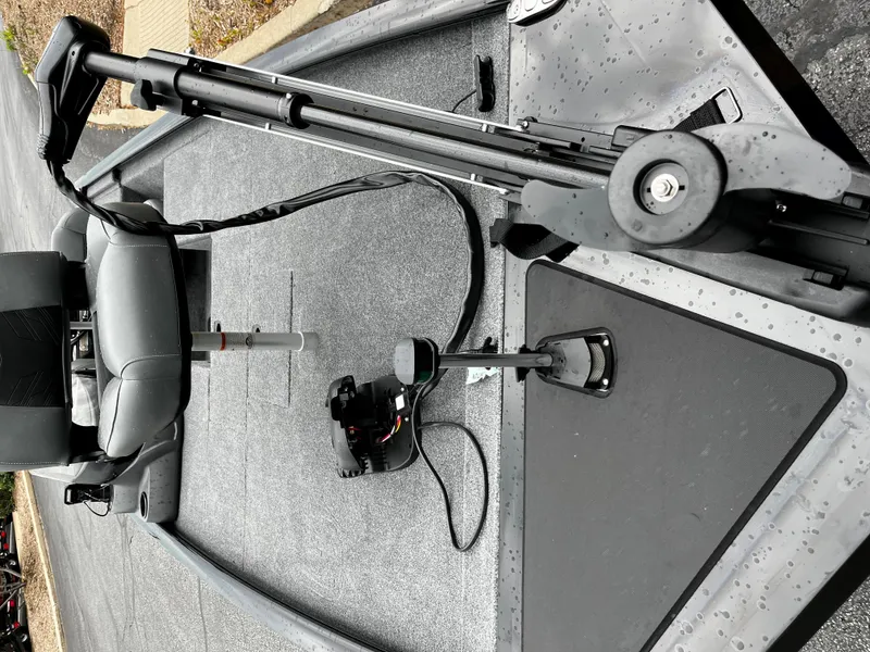 Slide: The Image of 2025 Tracker Pro 170 boat interior with seating and equipment, featuring a sleek design. - 2