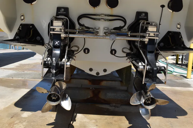 Slide: The Image of 2008 Formula 353 FASTech boat stern with dual propellers and outboard motors. - 11