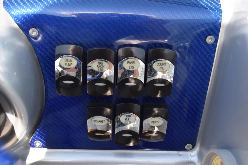 Slide: The Image of Control panel of a 2008 Formula 353 FASTech boat with labeled switches. - 26