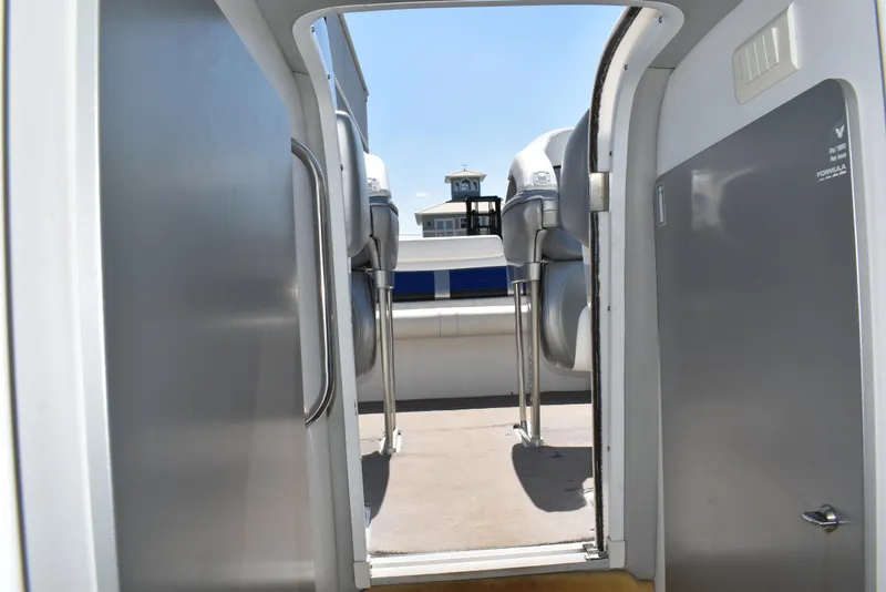Slide: The Image of 2008 Formula 353 FASTech boat interior view with seating and open hatch. - 30