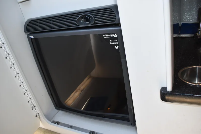 Slide: The Image of 2008 Formula 353 FASTech boat interior with compact refrigerator. - 31